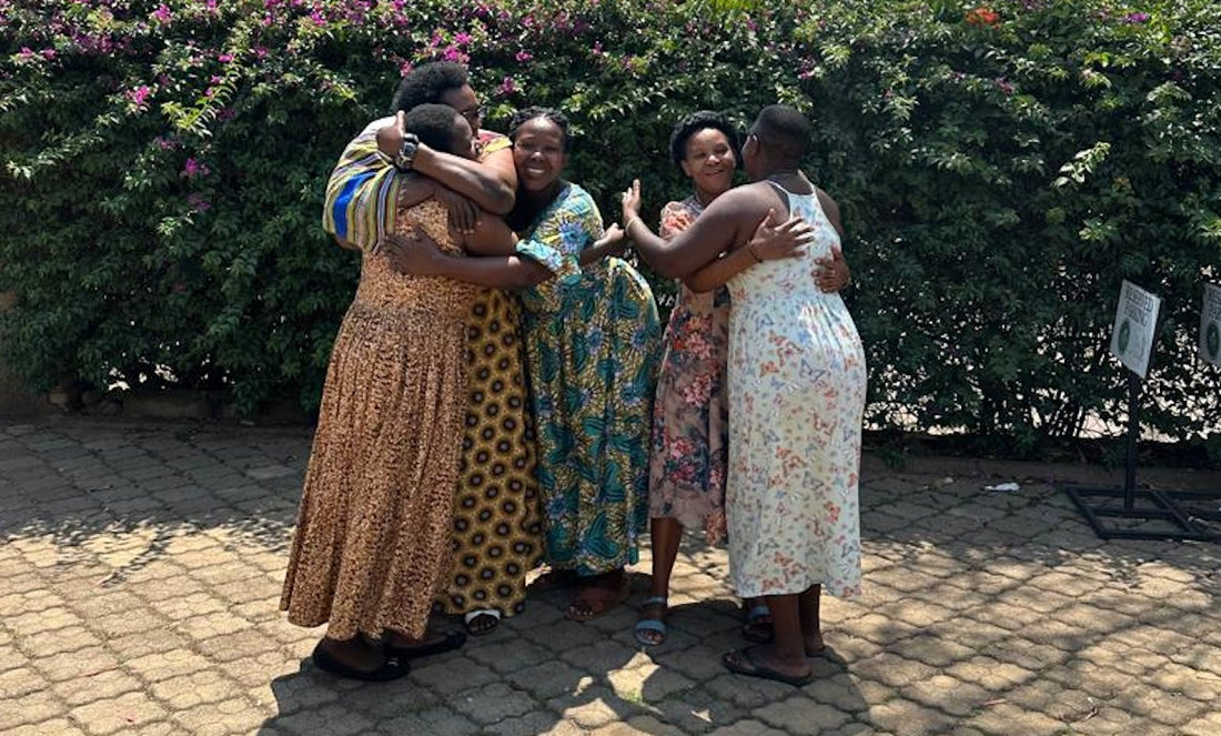 DuHope women embracing and smiling together